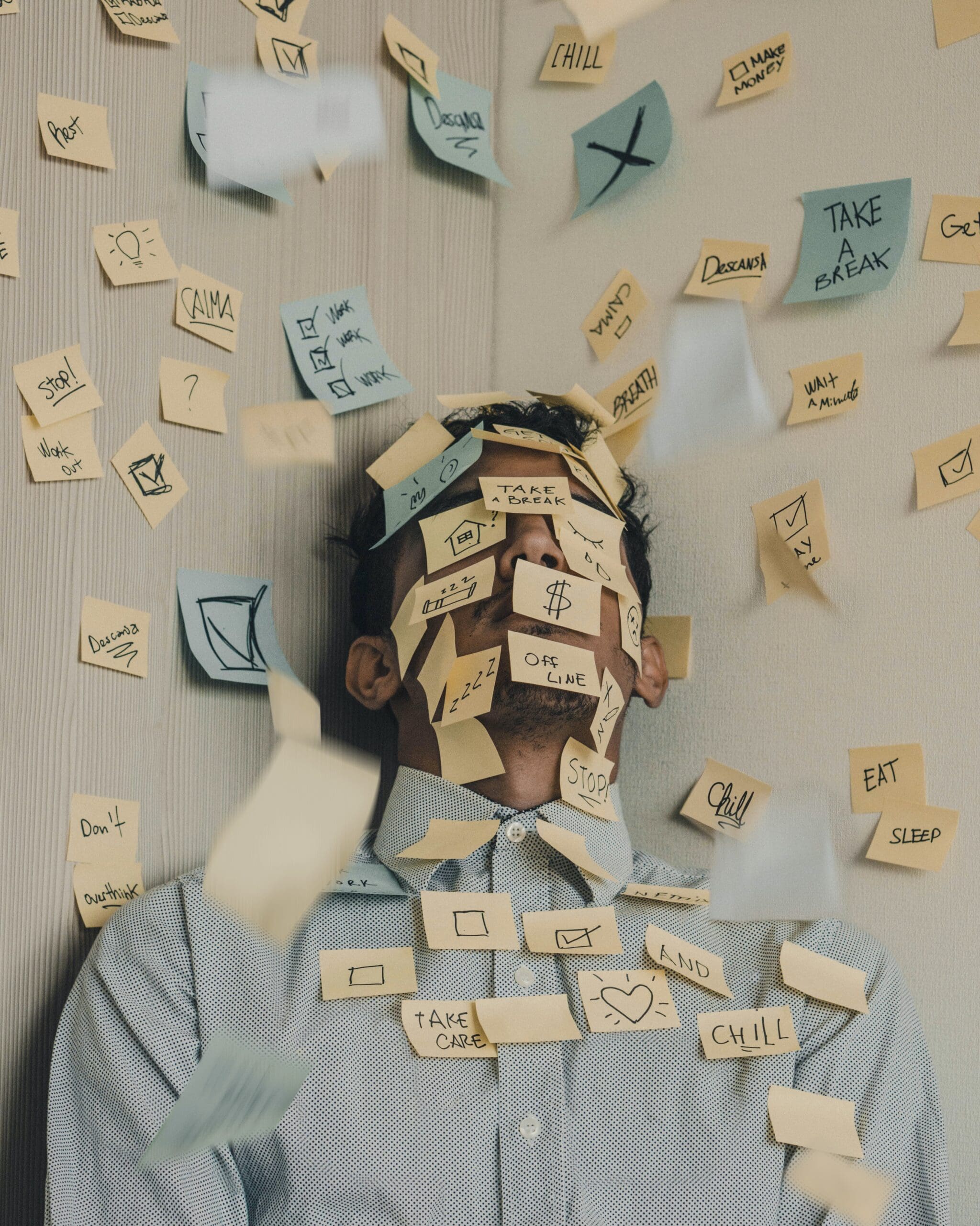 Photo of Man covered with sticky notes by Luis Villasmil for Unsplash